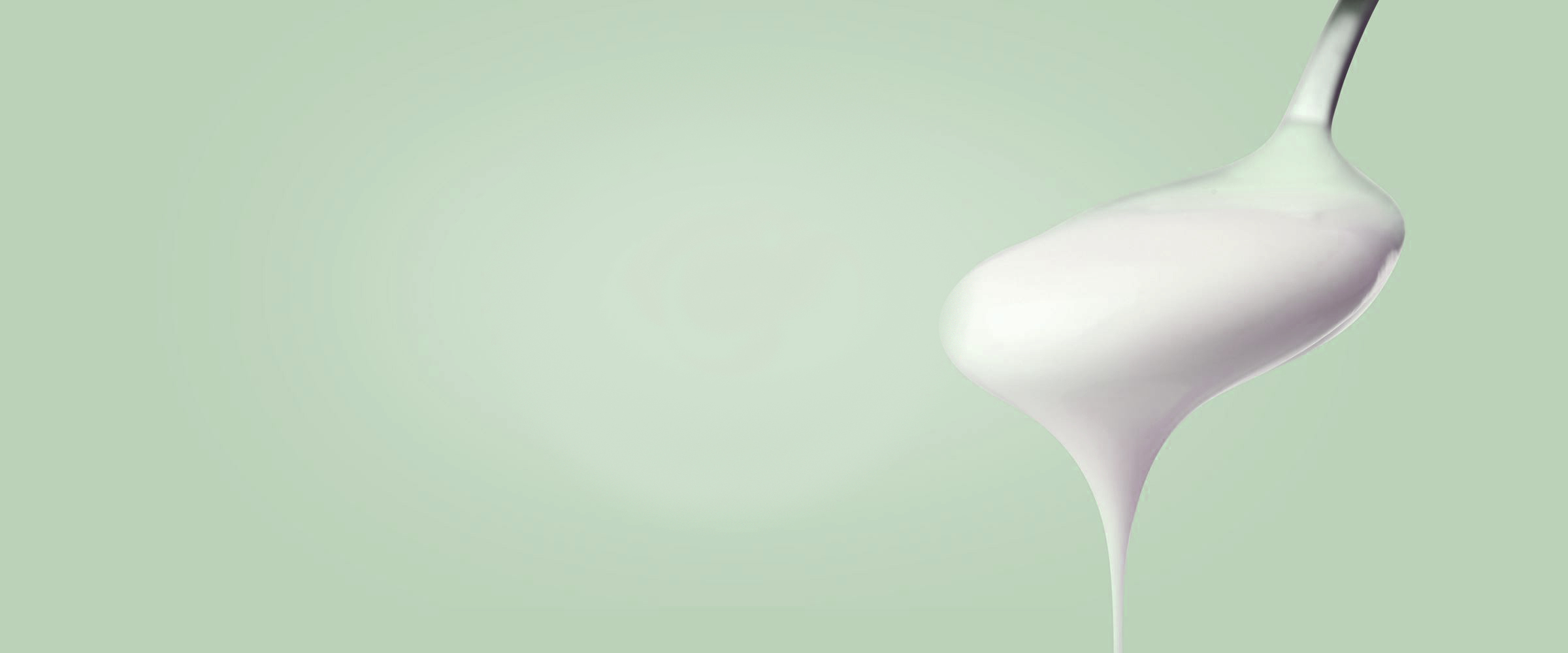 Achtergrond lepel Arla Lactofree yoghurt